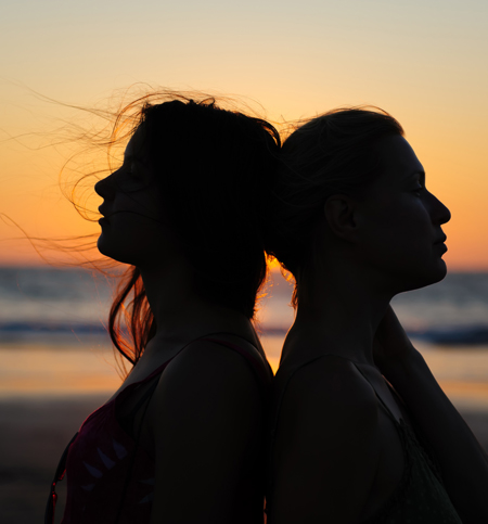 couple against sunset on beach